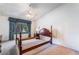 Light-filled bedroom featuring neutral carpet, a ceiling fan and a large window at 3108 Leafwood St, Las Vegas, NV 89108