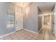 Inviting foyer with tile flooring, light gray walls and a view into the house beyond at 3108 Leafwood St, Las Vegas, NV 89108