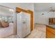 Bright kitchen with wooden cabinetry and stainless-steel refrigerator at 3108 Leafwood St, Las Vegas, NV 89108