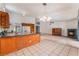 Bright kitchen with granite countertops, wooden cabinets, and stainless-steel appliances at 3108 Leafwood St, Las Vegas, NV 89108