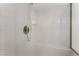 Shower stall with a white tiled surround and a built in seat at 3108 Leafwood St, Las Vegas, NV 89108