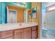 Bright bathroom with colorful walls, a single sink vanity, and a shower-tub combo at 3440 Bella Viera Ct, Las Vegas, NV 89141