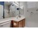 Bathroom features a large mirror, modern sink, and a shower with glass door at 3440 Bella Viera Ct, Las Vegas, NV 89141