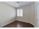 Bedroom with wood-look floors and a window at 3440 Bella Viera Ct, Las Vegas, NV 89141