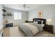 Cozy bedroom with neutral tones, ceiling fan, and ample space for furniture and decor at 3440 Bella Viera Ct, Las Vegas, NV 89141