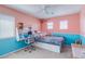 Cozy bedroom with a desk area, soft lighting, and a comfortable trundle bed at 3440 Bella Viera Ct, Las Vegas, NV 89141