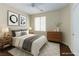 Well-lit bedroom featuring modern decor, a comfortable bed, and ample storage space at 3440 Bella Viera Ct, Las Vegas, NV 89141
