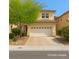 Charming two-story home featuring a well-maintained front yard and a spacious two-car garage at 3440 Bella Viera Ct, Las Vegas, NV 89141