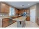 Modern kitchen with stainless steel appliances, granite countertops, and marble tile floors at 3440 Bella Viera Ct, Las Vegas, NV 89141