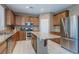 A modern kitchen with stainless steel appliances, granite countertops, and lots of cabinet space at 3440 Bella Viera Ct, Las Vegas, NV 89141