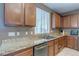 Well-lit kitchen features granite countertops, stainless steel appliances and plenty of cabinet space at 3440 Bella Viera Ct, Las Vegas, NV 89141