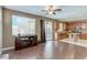 Open-concept living area flows into a modern kitchen, with hardwood floors and ample natural light at 3440 Bella Viera Ct, Las Vegas, NV 89141
