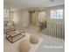 Upstairs living room featuring comfortable seating, neutral tones, and modern décor at 3440 Bella Viera Ct, Las Vegas, NV 89141
