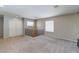 Spacious carpeted loft area with railing and lots of natural light at 3440 Bella Viera Ct, Las Vegas, NV 89141