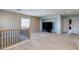 Open loft area with plush carpeting, a media niche and lots of natural light at 3440 Bella Viera Ct, Las Vegas, NV 89141