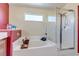 Inviting main bathroom with a separate shower and tub, and a large window at 3440 Bella Viera Ct, Las Vegas, NV 89141