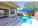 Inviting backyard pool with covered patio, perfect for enjoying outdoor living and entertaining guests in comfort at 3440 Bella Viera Ct, Las Vegas, NV 89141