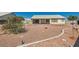 Spacious backyard featuring a patio, rock features and a low-maintenance desert landscape at 3912 Branchwood Dr, North Las Vegas, NV 89032