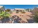 Low-maintenance backyard with gravel landscape, desert plants, and defined borders at 3912 Branchwood Dr, North Las Vegas, NV 89032