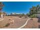 Landscaped backyard features rock features, desert plants, and a low-maintenance design at 3912 Branchwood Dr, North Las Vegas, NV 89032