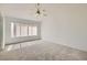 Bedroom featuring carpet, window with blinds, and ceiling fan with lighting at 3912 Branchwood Dr, North Las Vegas, NV 89032