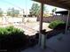 View of the landscaped backyard featuring a brick border and gravel at 3954 Saddlewood Ct, Las Vegas, NV 89121