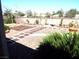 View of the landscaped backyard featuring a brick border and gravel at 3954 Saddlewood Ct, Las Vegas, NV 89121