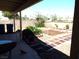 View of the landscaped backyard featuring a brick border and gravel at 3954 Saddlewood Ct, Las Vegas, NV 89121