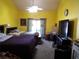 Spacious bedroom with high ceilings, ceiling fan, and sliding glass door leading to the outside at 3954 Saddlewood Ct, Las Vegas, NV 89121