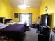 Spacious bedroom with high ceilings, ceiling fan, and sliding glass door leading to the outside at 3954 Saddlewood Ct, Las Vegas, NV 89121