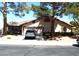 Charming single-story home featuring a tile roof, two-car garage and mature landscaping at 3954 Saddlewood Ct, Las Vegas, NV 89121