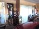 View of the garage with water heater, and storage shelves with clutter at 3954 Saddlewood Ct, Las Vegas, NV 89121