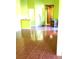 Bright living room with tile floors and green walls at 3954 Saddlewood Ct, Las Vegas, NV 89121