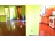 Bright living room with tile floors and green walls at 3954 Saddlewood Ct, Las Vegas, NV 89121