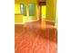 Bright living room with tile floors and green walls at 3954 Saddlewood Ct, Las Vegas, NV 89121