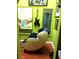 Well decorated office space with hardwood floors and massage chair at 3954 Saddlewood Ct, Las Vegas, NV 89121