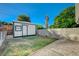 Backyard area showing a shed with a small window, gravel and grass at 4284 Parkdale Ave, Las Vegas, NV 89121