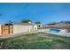 Landscaped backyard with a pool and a storage shed, providing ample space for outdoor enjoyment at 4284 Parkdale Ave, Las Vegas, NV 89121