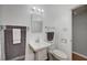 The bathroom features a sink with new faucet, well-lit mirror, and white toilet at 4284 Parkdale Ave, Las Vegas, NV 89121