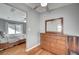 This bedroom features wood flooring, a ceiling fan, and a spacious walk-in closet at 4284 Parkdale Ave, Las Vegas, NV 89121