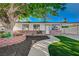 Single story home with walkway and xeriscaped yard, mature trees and RV Parking at 4284 Parkdale Ave, Las Vegas, NV 89121