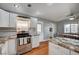 Bright kitchen with stainless steel appliances, granite counters, and views into the dining area at 4284 Parkdale Ave, Las Vegas, NV 89121