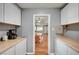 Bright kitchen features a view to the dining room area at 4284 Parkdale Ave, Las Vegas, NV 89121