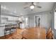 Bright kitchen features white cabinets, stainless steel appliances and a breakfast nook with wood table and chairs at 4284 Parkdale Ave, Las Vegas, NV 89121