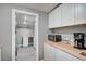 Bright laundry room area featuring built-in cabinets and countertop space at 4284 Parkdale Ave, Las Vegas, NV 89121