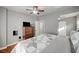 Cozy main bedroom featuring hardwood floors, ceiling fan, and closet at 4284 Parkdale Ave, Las Vegas, NV 89121