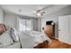 Comfortable main bedroom with hardwood floors, ceiling fan, and access to the exterior at 4284 Parkdale Ave, Las Vegas, NV 89121