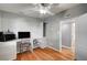 Bright home office with built-in desk, natural light, and stylish ceiling fan at 4284 Parkdale Ave, Las Vegas, NV 89121