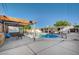 Backyard oasis with a sparkling pool, covered patio, and seating at 4284 Parkdale Ave, Las Vegas, NV 89121