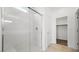 Bright bathroom featuring glass shower doors, neutral paint and access to walk-in closet at 4410 E Brusca Way, Pahrump, NV 89061